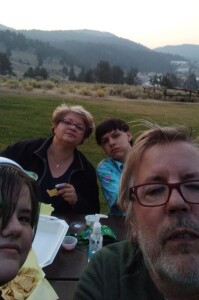 Family dinner at Mammoth Hot Springs, Yellowstone, of buffalo burgers purchased at food truck outside the park.